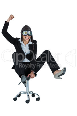 Businesswoman wearing aviator glasses sitting on office chair