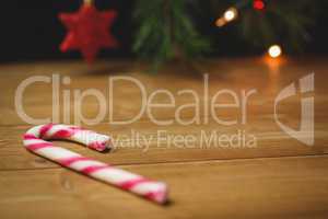 Candy cane on wooden table