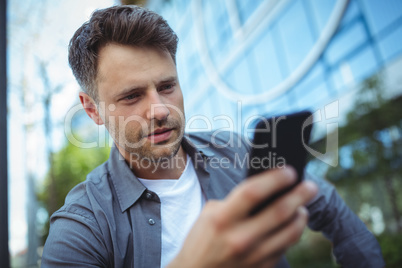 Handsome man using mobile phone