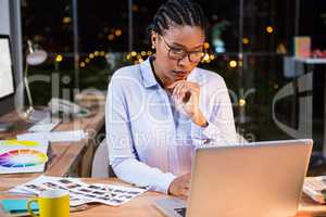 Businesswoman working on laptop