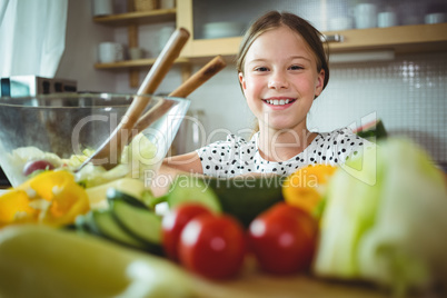 Portrait of girl standing in kitchen