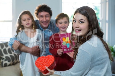Children giving present to their mother