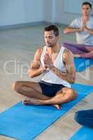 Young man performing yoga