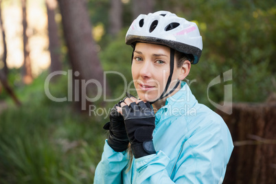 Portrait of female mountain biker wearing bicycle helmet