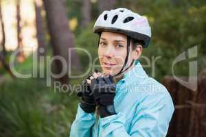 Portrait of female mountain biker wearing bicycle helmet