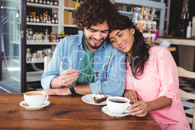 Couple having dessert and coffee