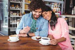 Couple having dessert and coffee