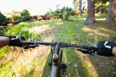 Close-up of male mountain biker riding bicycle