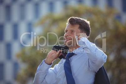 Handsome businessman talking on mobile phone