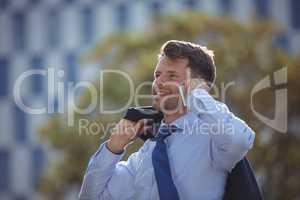 Handsome businessman talking on mobile phone