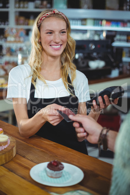 Customer giving credit card to waitress