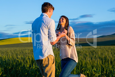 Couple having fun in field