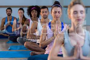 Group of people performing yoga