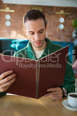 Man looking at menu