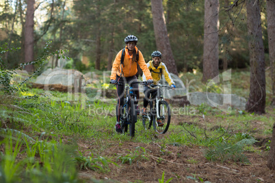 Biker couple cycling in countryside