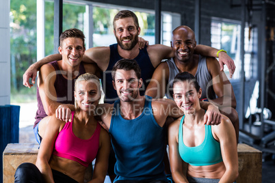 Cheerful multi-ethnic friends in gym