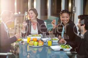 Group of businesspeople having breakfast