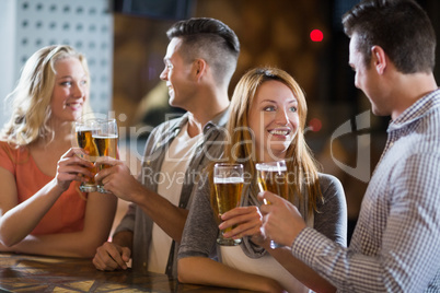 Friends toasting glasses of beer