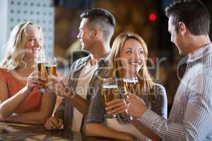 Friends toasting glasses of beer