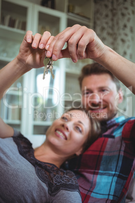 Happy couple holding their house key