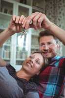 Happy couple holding their house key
