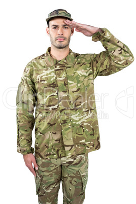 Portrait of confident soldier saluting