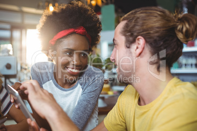 Man and woman using mobile phone