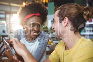 Man and woman using mobile phone