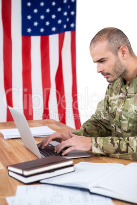 Solider using a laptop at desk