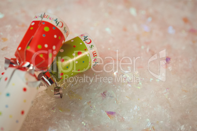 Close-up of christmas crackers on snow