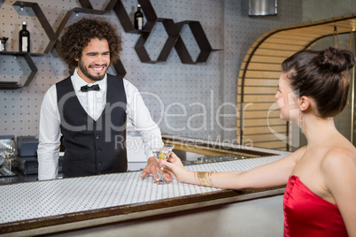 Waiter interacting with beautiful woman