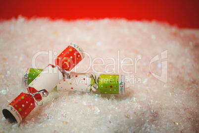 Close-up of christmas crackers on snow