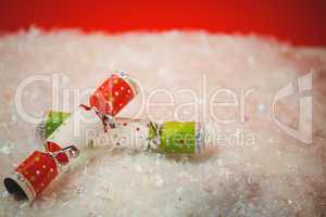 Close-up of christmas crackers on snow