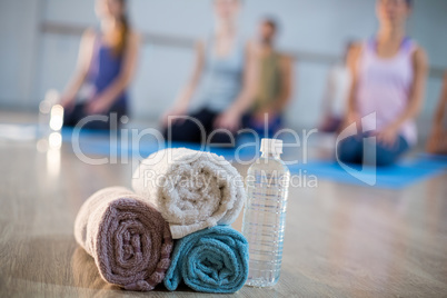 Close-up of towel and water bottle