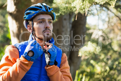 Male mountain biker wearing bicycle helmet