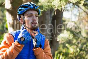 Male mountain biker wearing bicycle helmet