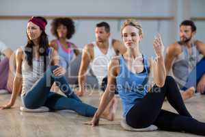 Group of people performing yoga
