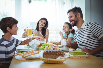 Happy family having breakfast