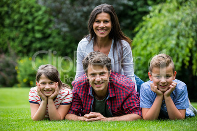 Happy family smiling in park