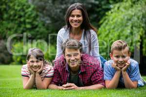 Happy family smiling in park