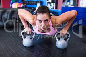 Portrait of female athlete doing push-ups