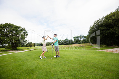 Couple giving high five to each other