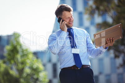 Handsome businessman talking on mobile phone