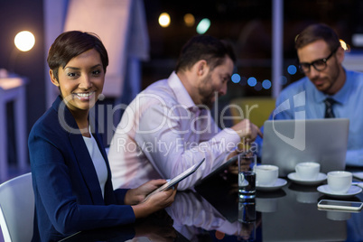 Businesswoman using digital tablet in office