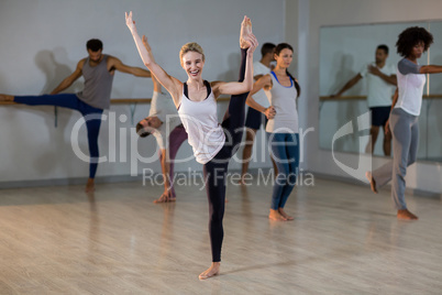 Woman performing stretching exercise Woman performing stretching exercise