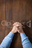 Praying hands of man