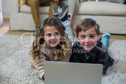 Portrait of children using laptop