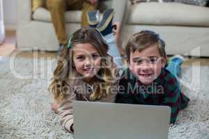 Portrait of children using laptop
