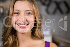 Smiling young woman in bar