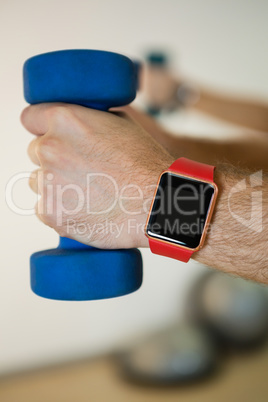 Man holding dumbbell